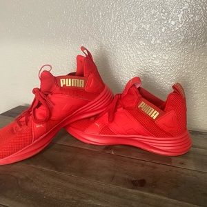 Woman’s red Puma shoes